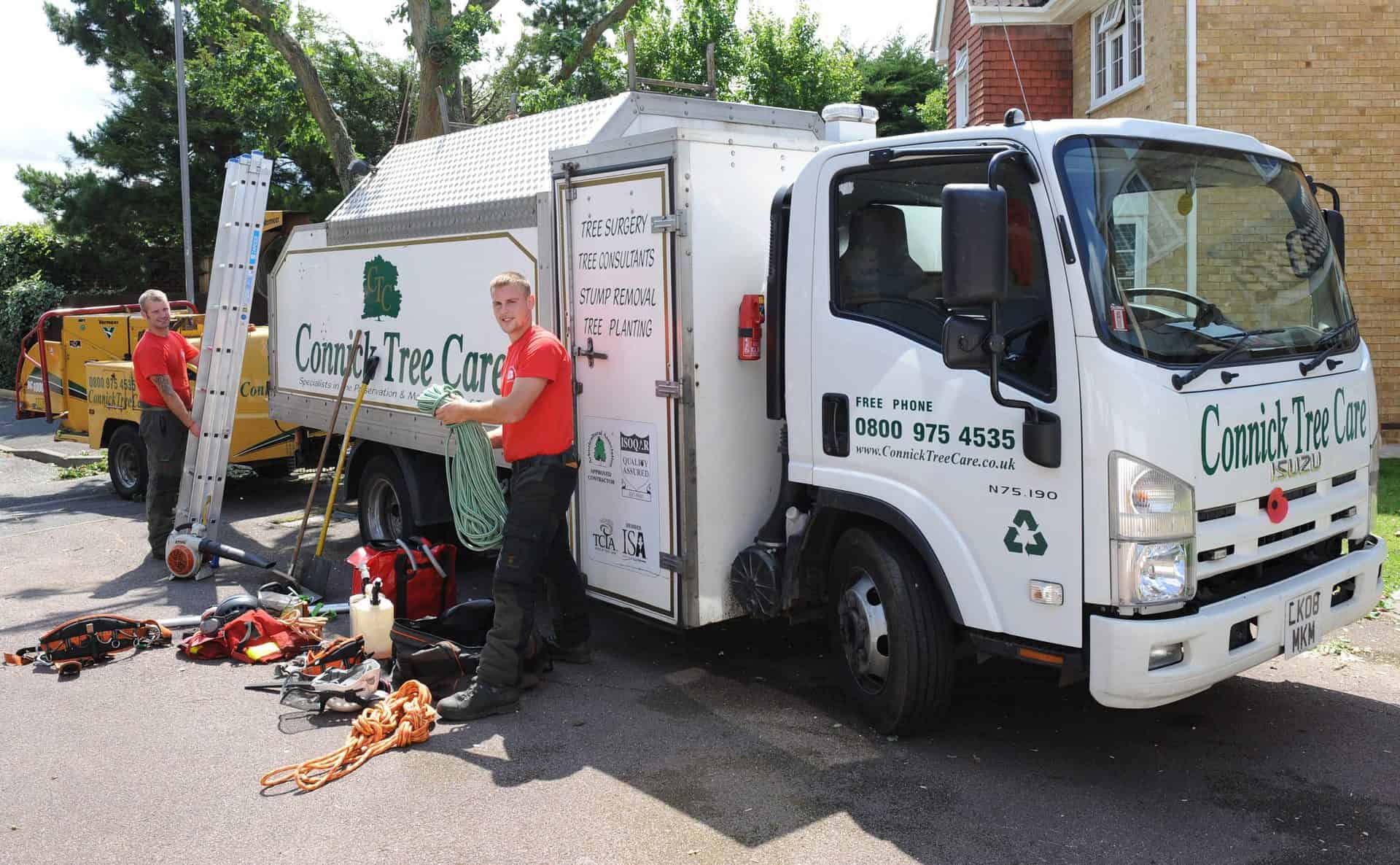 Members of the Connick Tree Care team loading up a truck