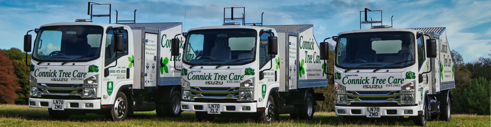 Banner showing three arboriculture lorries with Connick Tree Care branding