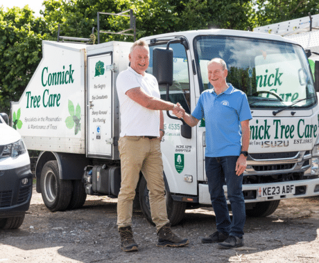 Dan Pennington and Mike Connick shaking hands