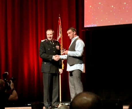 Mark Hyland being presented the award forActs of Outstanding Bravery by a Member of the Public by Surrey Fire and Rescue Service