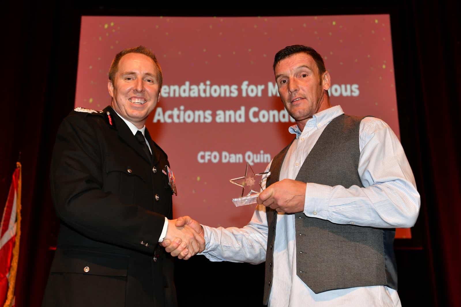 Mark Hayland receiving Outstanding Bravery award