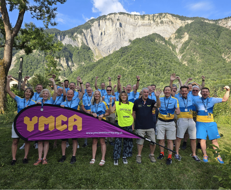 Cycling team celebrating having cyled in the Alps for YMCA East Surrey